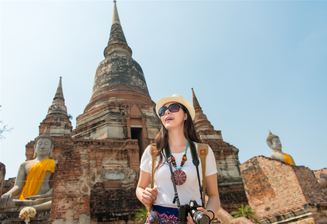Traveler at a torii gate in Japan